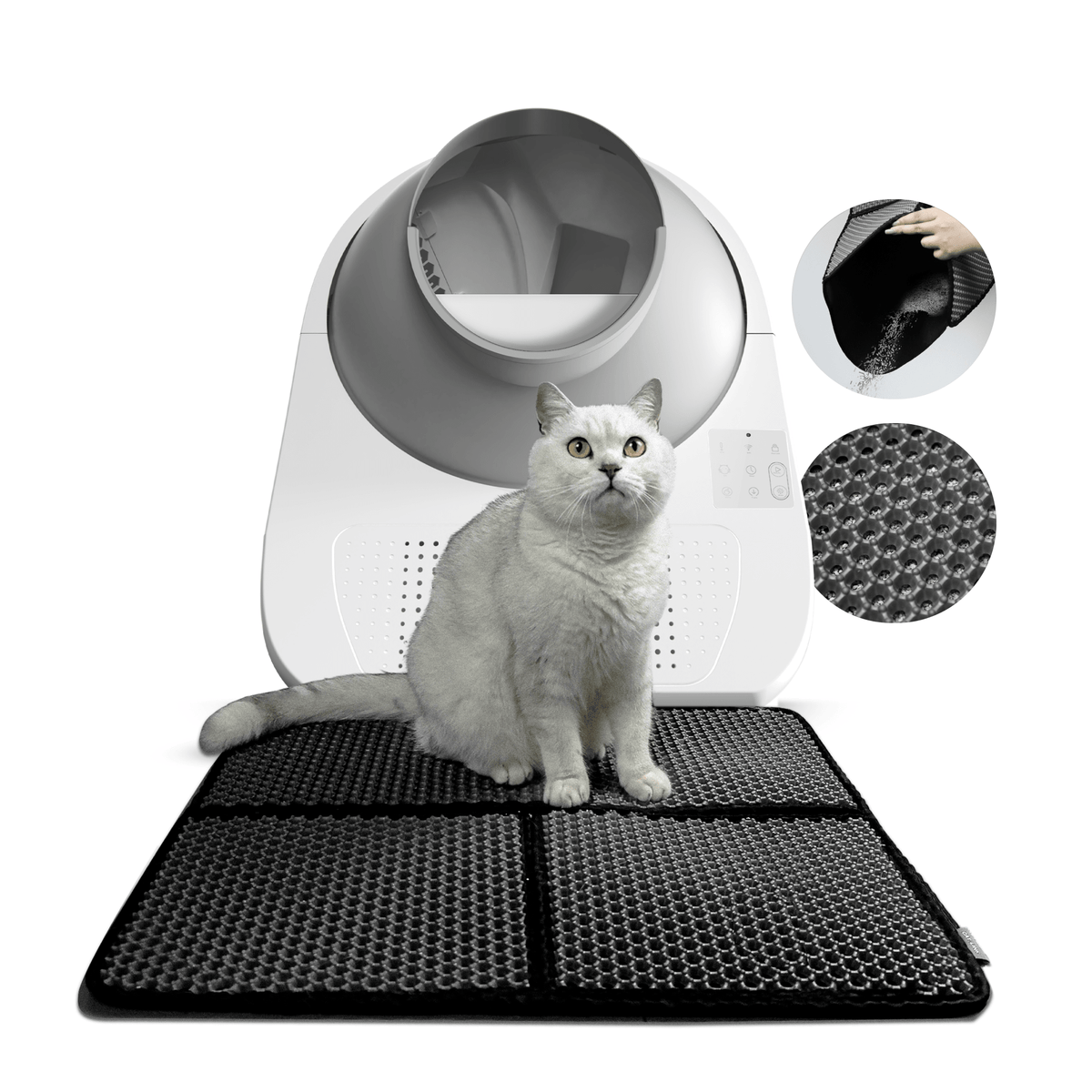 A white cat sitting on a black CATLINK double-layer litter mat in front of a litter box